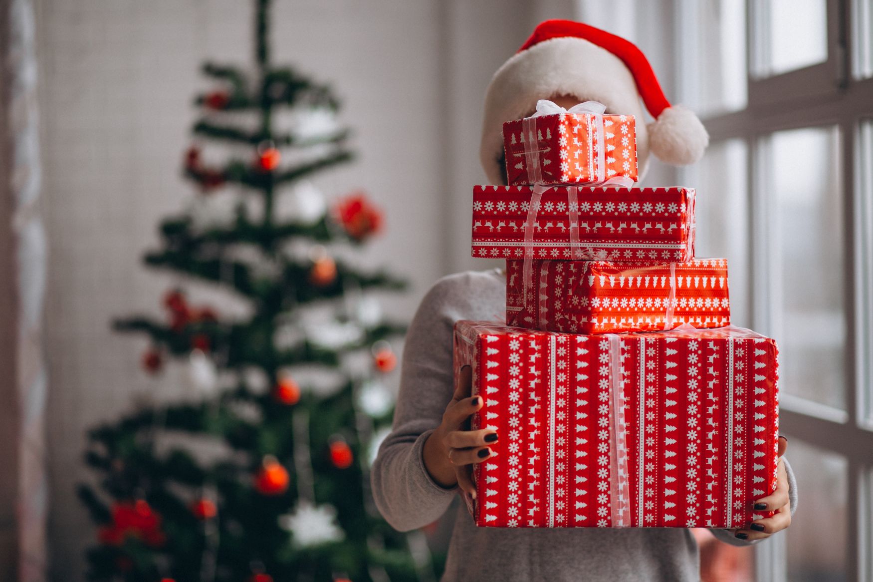 Woman holding big Christmas boxes